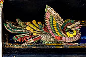 Bangkok Grand Palace,  entrance of the Phra Maha Monthian Group. A nice details of a decoration made of bits of colorerd  porcelain. 